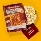 Momofuku Sweet & Spicy Noodles packaging on a yellow background