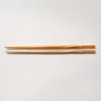 pair of Momofuku Chopsticks on White Background