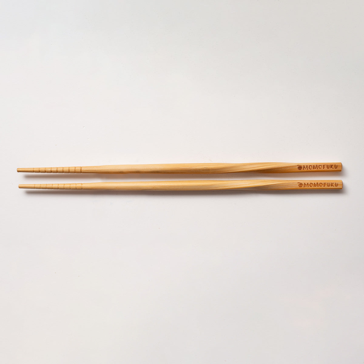 pair of Momofuku Chopsticks on White Background