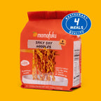 Momofuku Spicy Soy Noodles package on a yellow background with a '4 Meals Quality' badge.