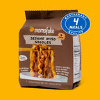 Momofuku Sesame Miso Noodles packaging on a yellow background with a '4 Meals Quality' badge.