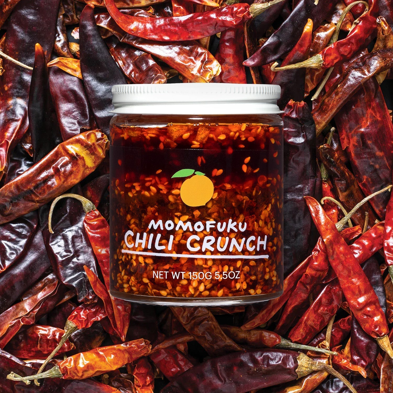 Jar of Chili Crunch on bed of Dried Chilis
