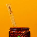 chili crunch spoon inside of a chili crunch jar